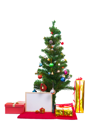 Decorated Christmas tree and gift boxes on white backgroundの写真素材