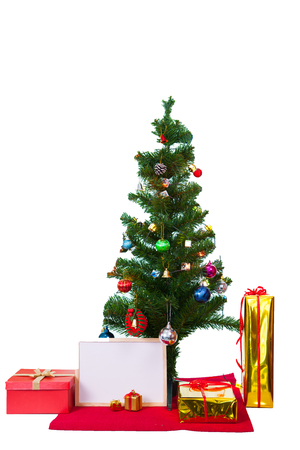 Decorated Christmas tree and gift boxes on white backgroundの写真素材