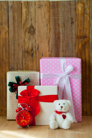 Christmas gift box on wooden background. Merry Christmas and Happy New Year!!の写真素材