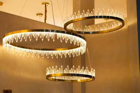 Beautiful chandelier. luxury expensive chandelier hanging under ceilingの写真素材