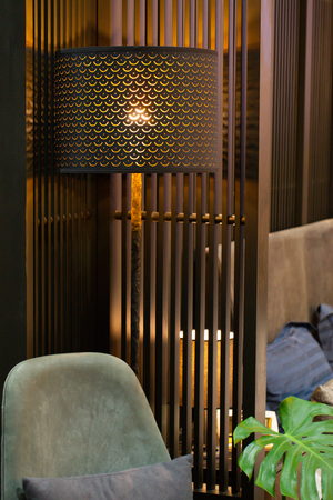 Modern home interior with bedroom setting including bedside table with lamp.の写真素材