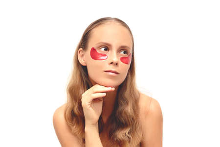 Beautiful young girl with long brown hair, with under eye red patches. Naked, isolated, on a white background.の写真素材