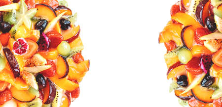 Cake with fruits isolated on white background, top view. Banner. Strawberry and pear, fig and grapes, plum and peach.の写真素材