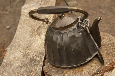 Retro teapot on the wood の写真素材