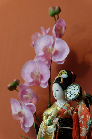 japannese doll and flowersの写真素材