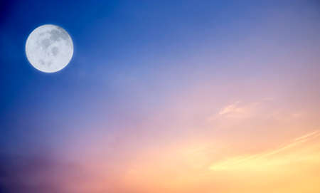 Dramatic twilight and sunset sky with full moon.Image of full moon furnished by NASA.の写真素材