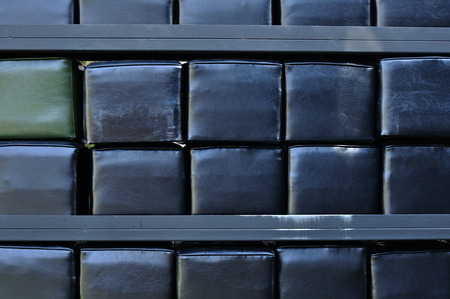 Stack of black cushions in shelfの写真素材