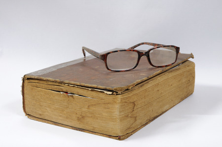 Ancient book with glasses, education concept.の写真素材