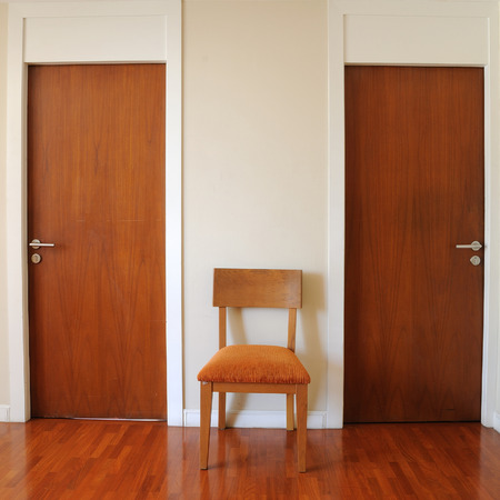 Classic design, double wooden doors with chair.の写真素材