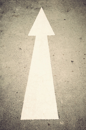 White arrow direction on road, の写真素材