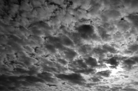 Many cloud in sky, starting raining. Monochrome.