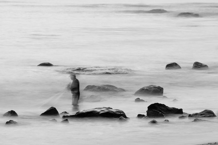 Morning beach with blur wave by use long exposure camera techniqueの写真素材