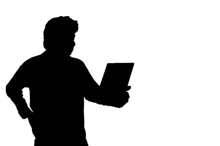 Asian business man looking to paper silhouette in studio isolated on white background with clipping path.の写真素材