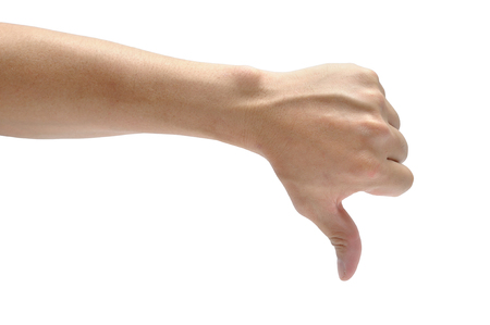 Male hand thumb down isolated on white background. Body part action.の写真素材