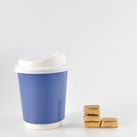 Small candies with take home paper coffee cupの写真素材