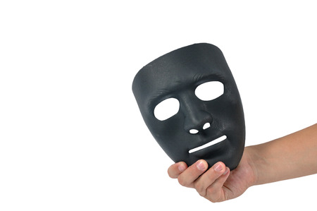 Man hand holding black mask, human behaviourの写真素材