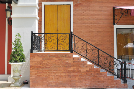 Yellow door with classic stairsの写真素材