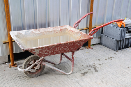Industrial wheelbarrow in construction siteの写真素材