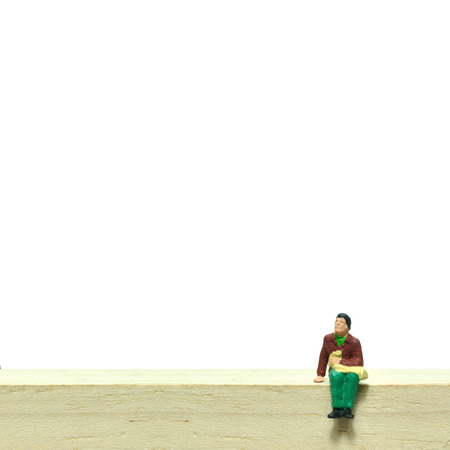 Selective focus, miniature people sitting on wooden block, business concept.の写真素材