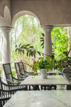 Marble food table and chair set outdoor with plant.の写真素材