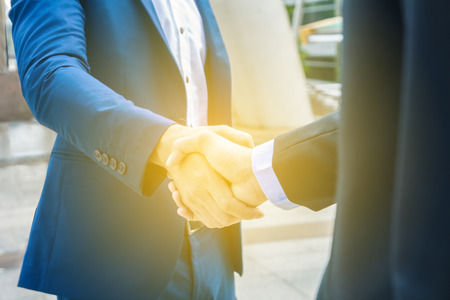Middle business man shaking hands finished agreement after meeting.の写真素材