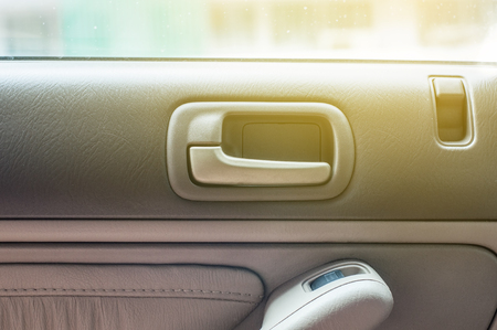 Car door open handle inside with luxury interiorの写真素材