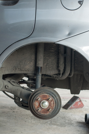 Car changing new tire lift up car by use hand jack.の写真素材