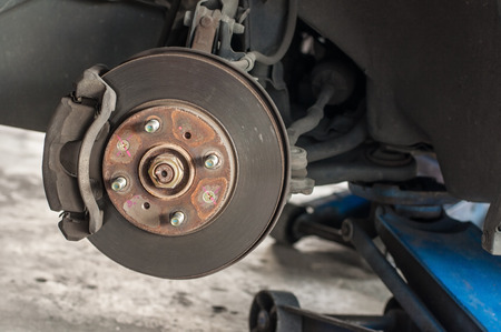 Car changing new tire lift up car by use hand jack.の写真素材