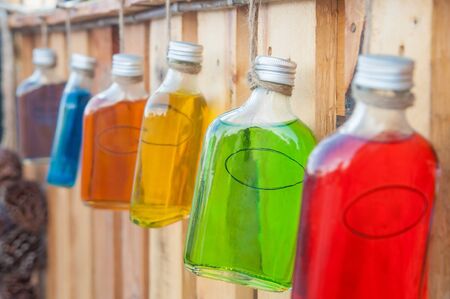 Colorful syrub in bottles for house interiorsの写真素材