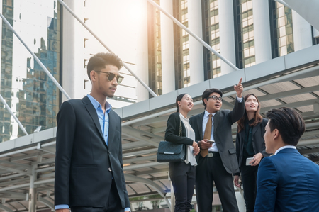 Asian middle business people in activity action.の写真素材