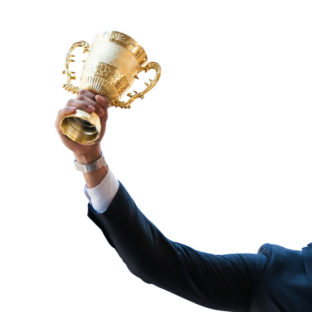Success business man holding golden trophy cup with right hand, Business executives rejoice in their leadership in business competition.  Congratulations to the gold trophy.の写真素材