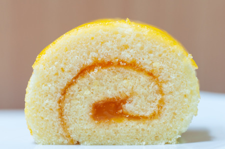 Orange cake roll, desert butter cake with orange jam.  Type of bakery.の写真素材