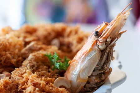 Fried crispy shrimp on plate, shrimp head decorate in food menu.の写真素材