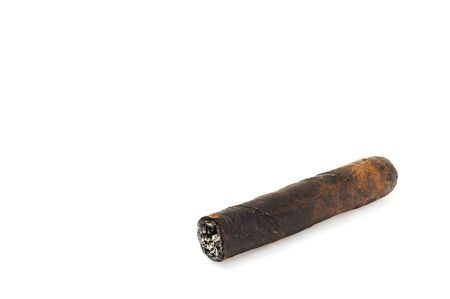 Cut and burned cigar on white background, world no tobacco day. Premium cigars from Havana, Cuba.の写真素材