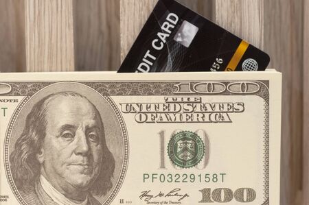 Black credit card dollar american banknote for payment disburse debt and investment, currency financial concept.の写真素材