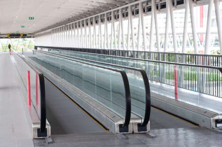 Moving escalator walkway in airport,  shopping mall moving walkway.の写真素材