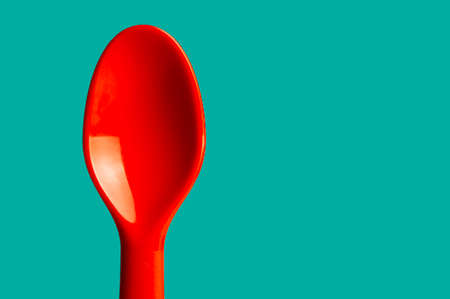 Red spoon for children, utensil use for picnic.の写真素材