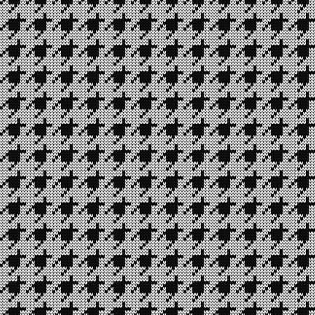 Knitted black and white goose foot pattern. Seamless fabric design. vector illustration.