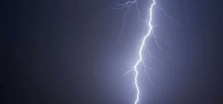 Thunderbolt strike on the sky at night timeの写真素材