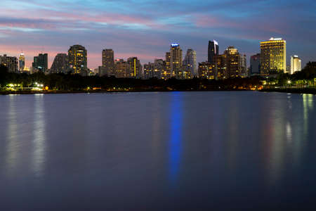 Twilight in bangkok city beautiful sky on background and lake on foregroundの写真素材