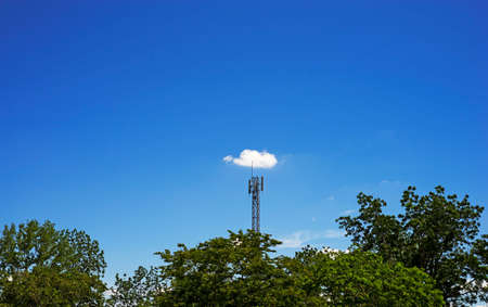 White cloud on signal pole and clear blue sky on background