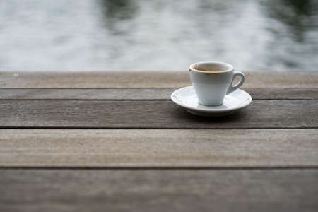 White espresso cup on wood table, focus on coffee  cup.の写真素材