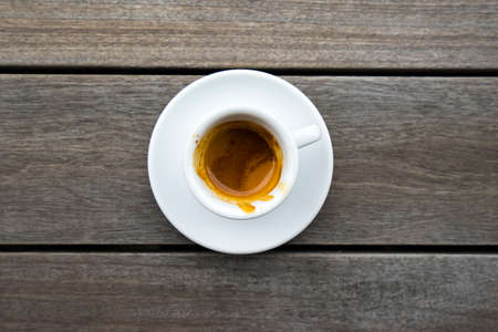 Top view of espresso in white cup on wood table.の写真素材
