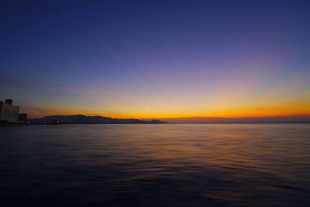 Red light of sunset on horizon before dark.の写真素材