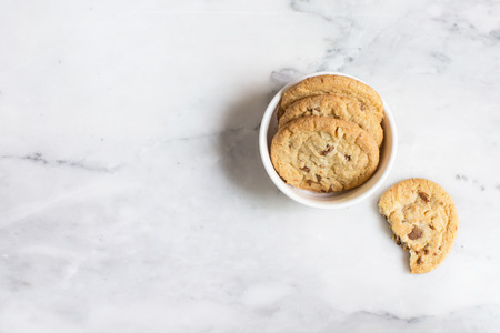 Overhead view of chocolate chip cookies in the bowlの写真素材