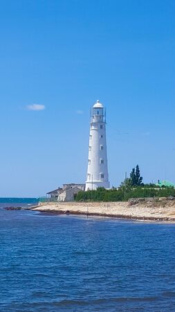 Lighthouse on a Sunny day with blue sky.の写真素材