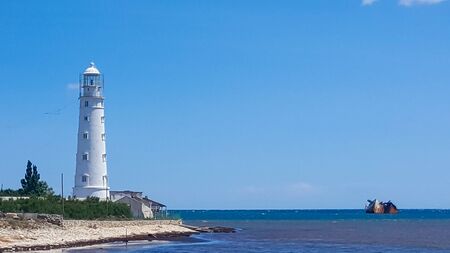 Lighthouse on a Sunny day with blue sky.の写真素材