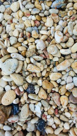 The texture of gravel with beautiful colors. ground pebble background. Beautiful background texture...