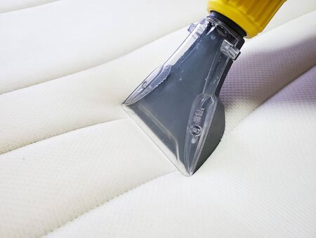 Mattress dry cleaning with professional extraction method. Close up.の写真素材
