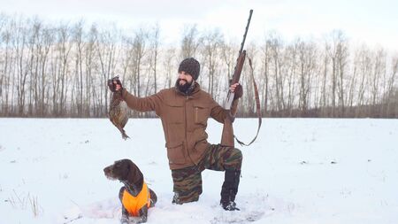 the young hunter shows off her booty game. hobby hunting.の写真素材